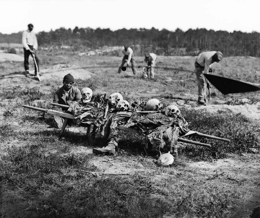 African-Americans collect the bones of soldiers killed in battle at Cold Harbor, Virginia, June 1864.