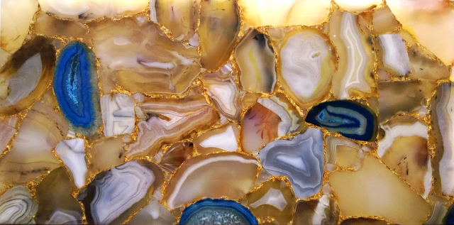 Each semi-precious stone is individually cut and bound together with an epoxy resin to create not only stunning slabs, but true works of art. Install semi-precious stone slabs on a bar counter top, a kitchen table, a vanity, on a wall.