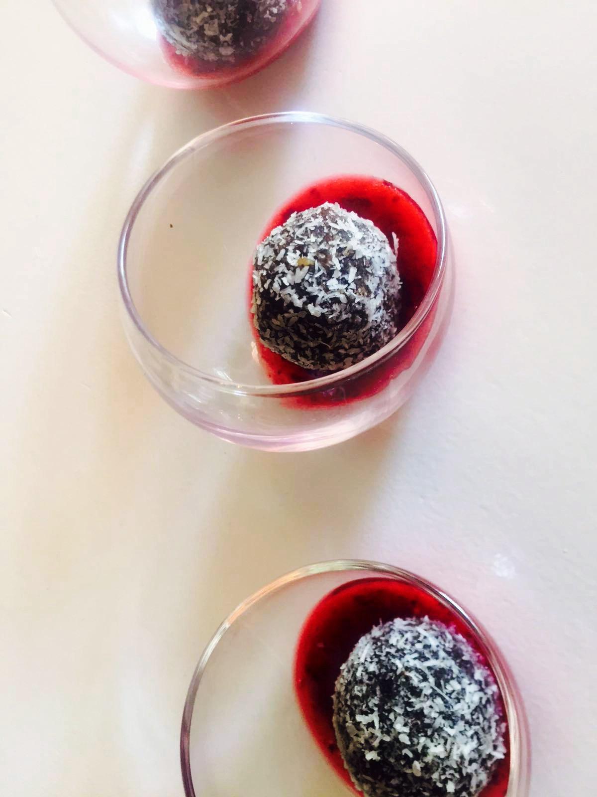 Raw carob bars with mixed berry sauce.
