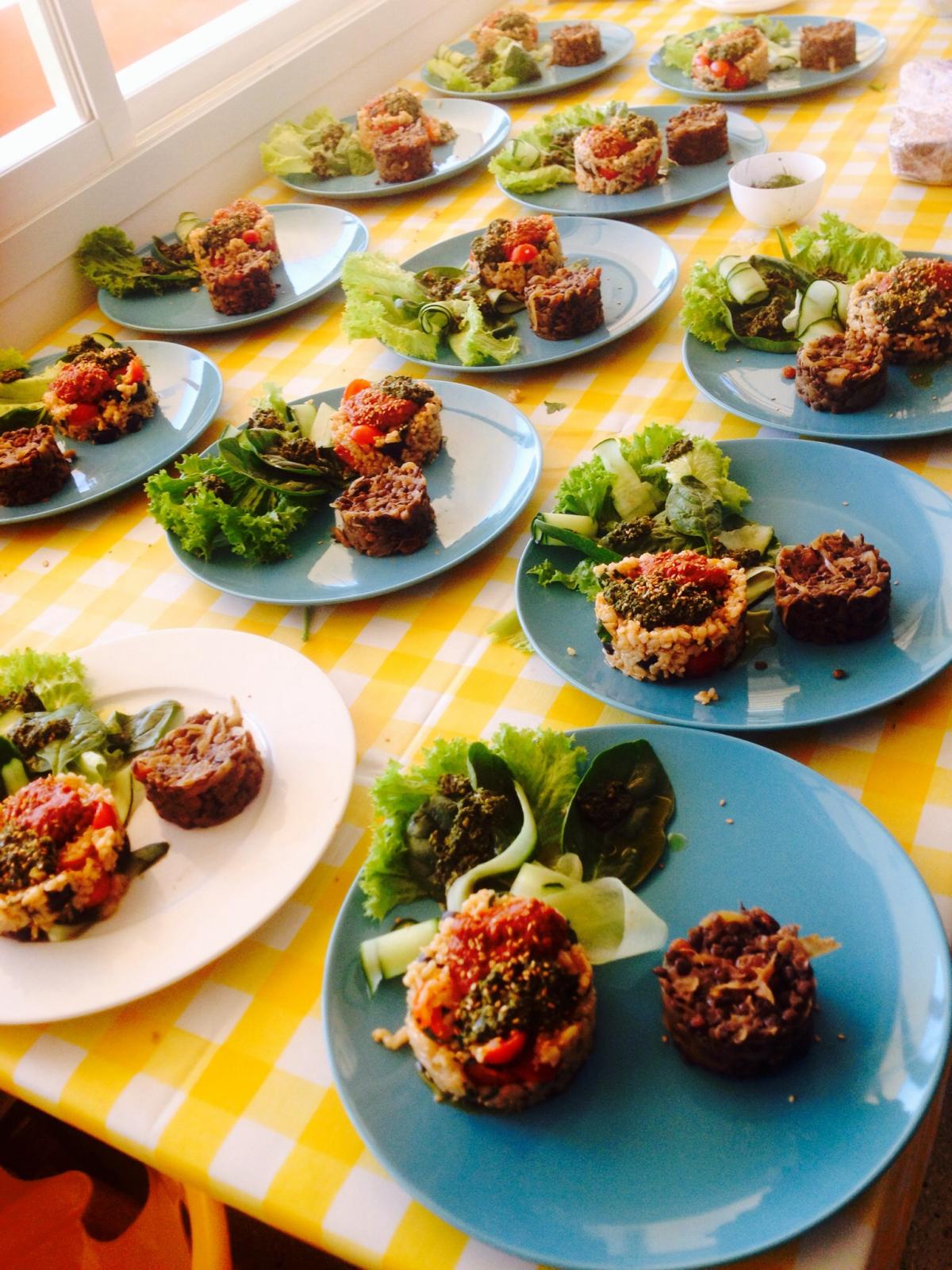 Mediterranean rice with pesto sauce and sun dried tomatoes. Tabbouleh salad and sweet green lentils.