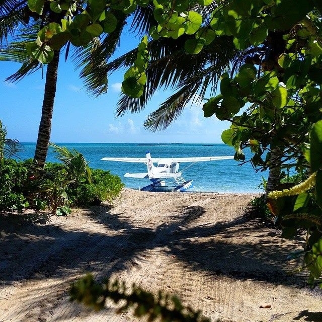 Arrive by seaplane and walk up to your beach front hideaway