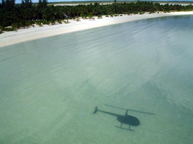 Arrive from Nassau or Miami 
by seaplane or helicopter