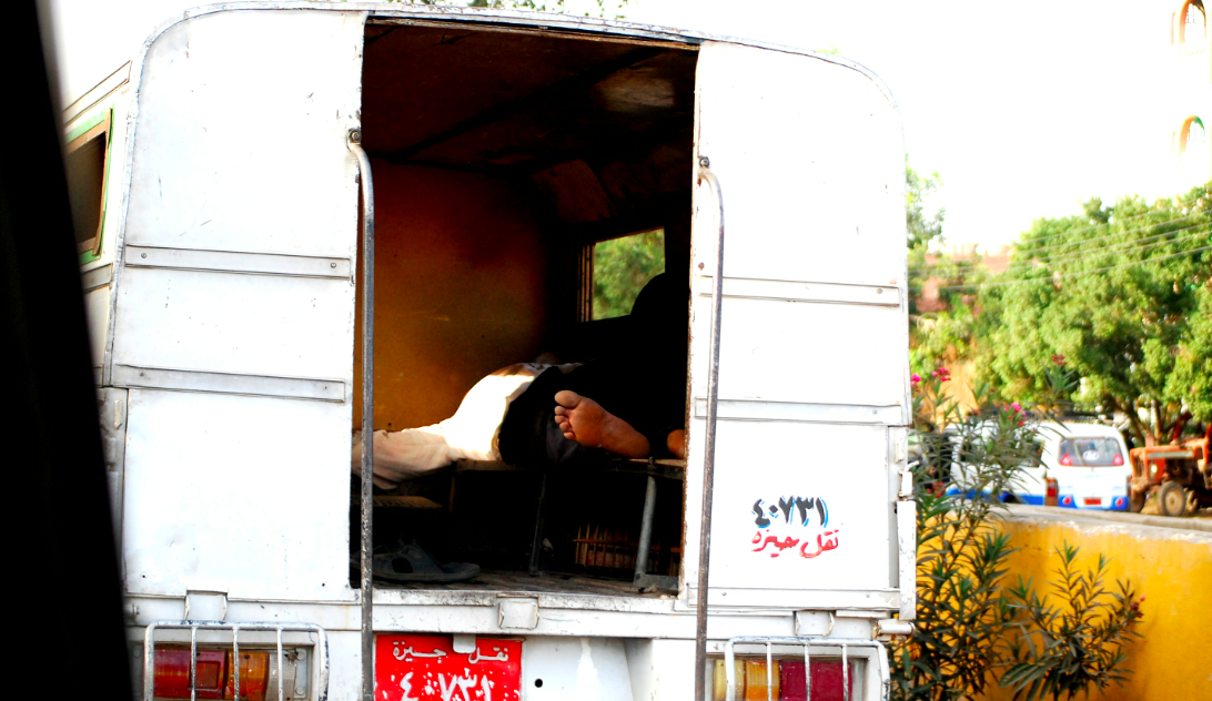 A man talking a nap in the back of his truck
Cairo, Egypt